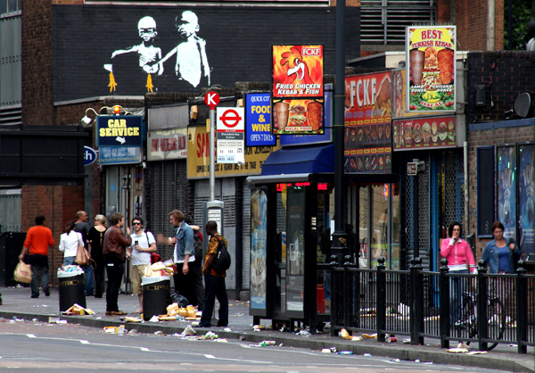 Street art by Mantis in Old Street complete with a reference to the artwork that previously occupied this space - Banksy's own reference to Pulp Fiction