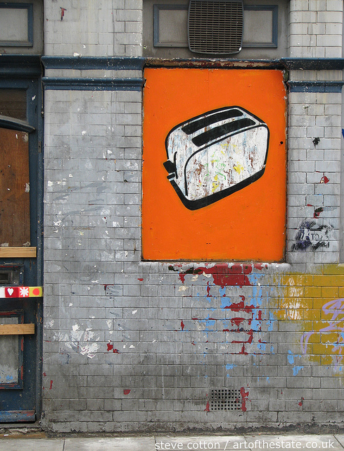 Toasters in a boarded up window