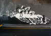 Banksy_riding_waves_cops.jpg (49093 bytes)