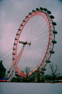 London Eye with snow and red lights