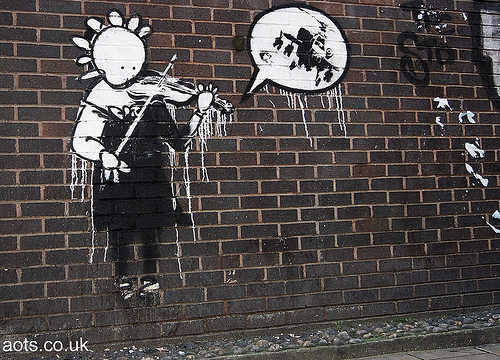 Banksy graffiti helicopter and violin player