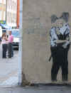 banksy_kissing_cops_scrubbed.jpg (46815 bytes)