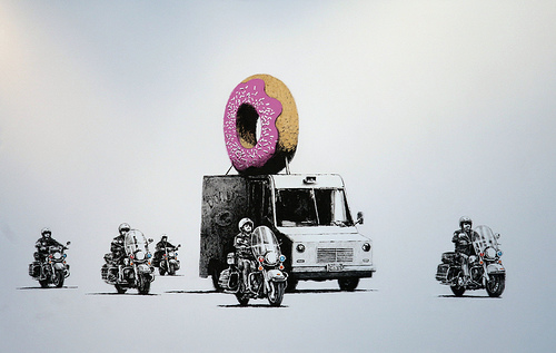 Banksy cop donuts