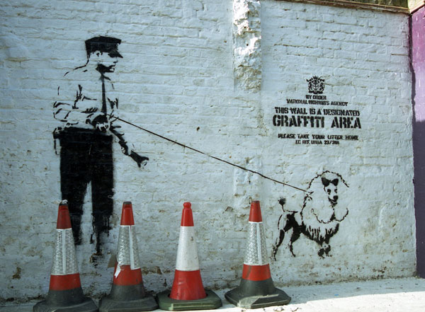 Banksy - Designated Graffiti Area with guard and dog 