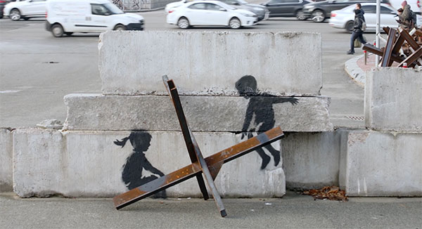 Banksy see saw children in Ukraine