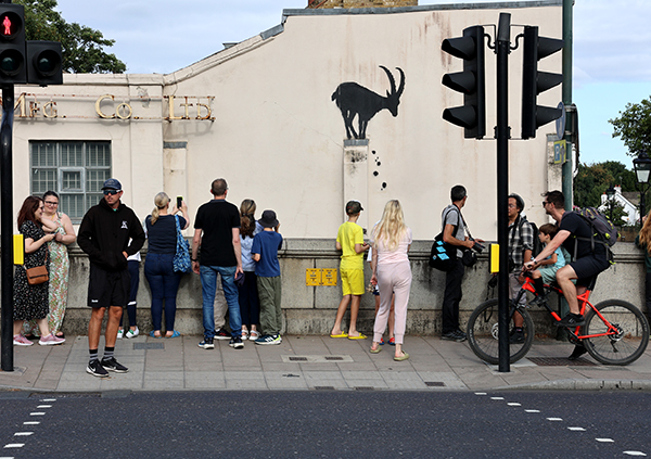 Banksy goat on Kew Bridge and crowds