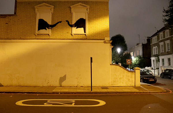 Banksy's twin elephants in Chelsea at night