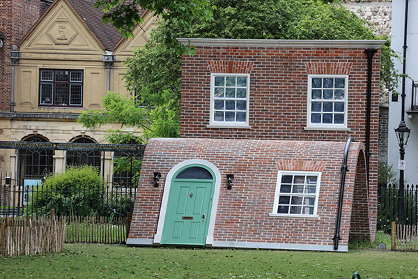 Alex Chinneck - 'A Week At The Knees' installation at Charterhouse Square.