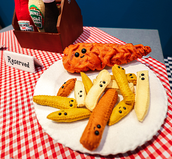 A plateful of felt fish and chips at Lucy Sparrow's Bourdon Street Chippy show