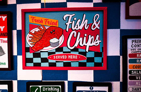 Fish and Chips served here sign at the Bourdon Street Chippy