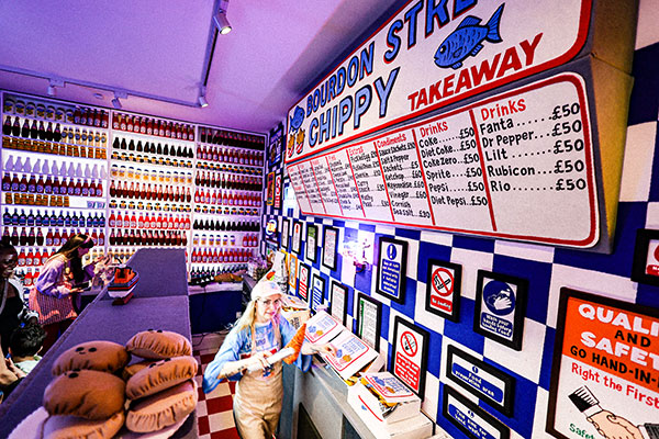 Lucy Sparrow hard at work, preparing another order behind the counter at the Bourdon Street Chippy