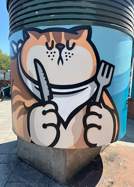 Art by Roo on a circular pillar as park of the Kingston Street Art Festival
