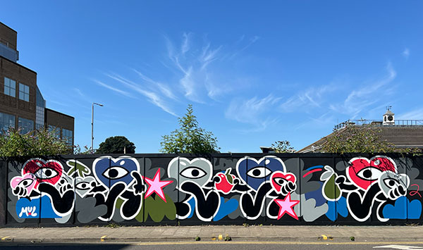 Mul Draws on hoardings as part of the Kingston Street Art Festival