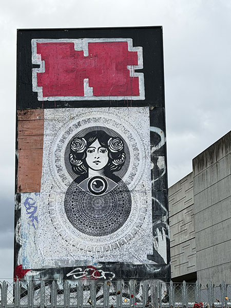 Shepard Fairey paste up under a Helch, opposite Shoreditch High Street station (October 2025)